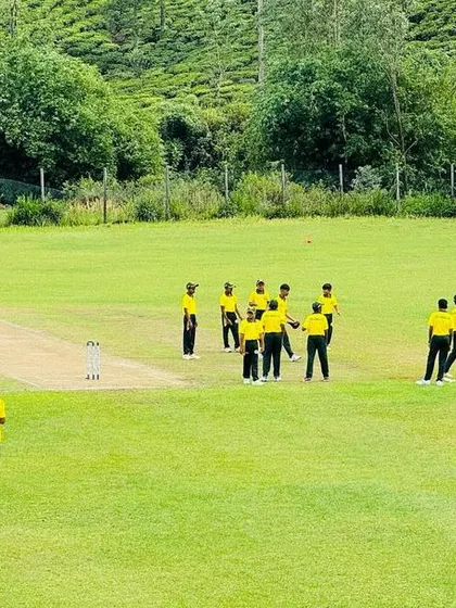A fielding team gathers around the pitch during a game in Sri Lanka.