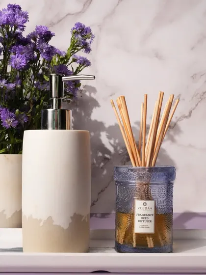 Our Bulgarian Lavender reed diffuser, elegantly placed in a bathroom setting. This calming fragrance is available across our entire product range, from candles to electric oil burners.