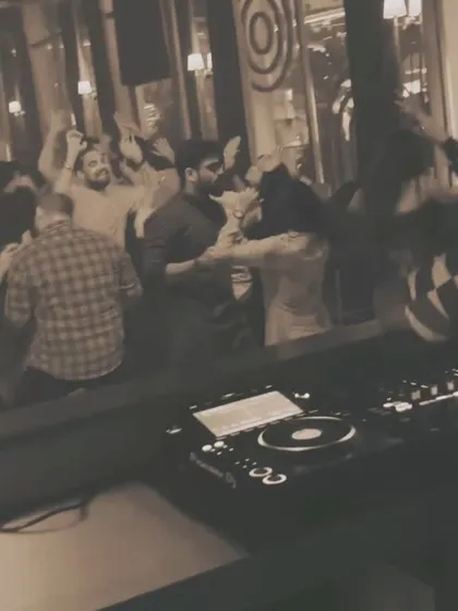 A sepia-toned look at the dancefloor from my booth. It shows a timeless party scene, proving that good music and good company never go out of style.