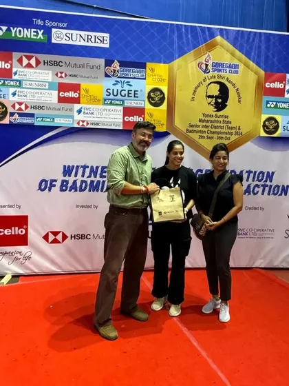 Presenting a gift to a winner, celebrating her victory at the tournament we organized.