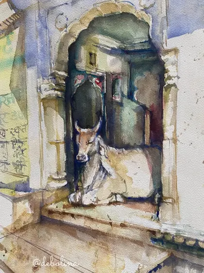 A cow resting peacefully in the alcove of an old building. This is one of the most common and endearing sights on Indian roads, and it's one of my favorite subjects to paint in watercolor.