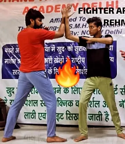 Two fighters, Armaan and Rehman, face off in a ready stance. This moment before the action shows the focus and respect central to our sparring practice.
