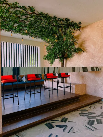 This image collage shows different elements of a large balcony, including a bar area with red stools and a seating nook under a large artificial tree.
