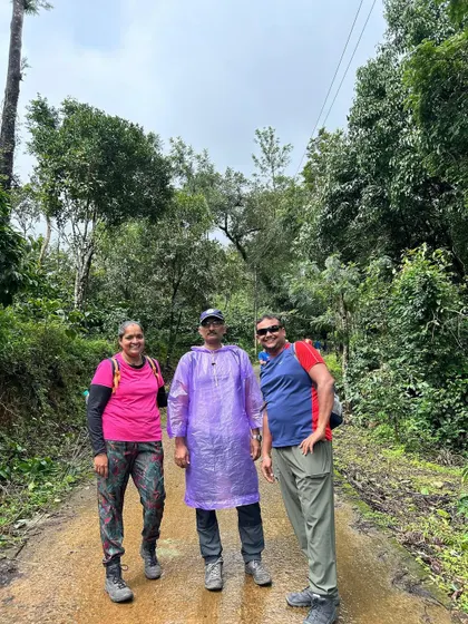 Trekkers in their rain gear on a muddy path during the Thadiyandamol trek. A little rain can't stop our spirits.