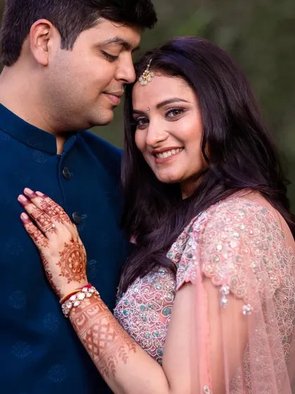 A beautiful close-up portrait of a newly engaged couple. The bride's intricate henna and the genuine smiles make this a heartwarming shot.