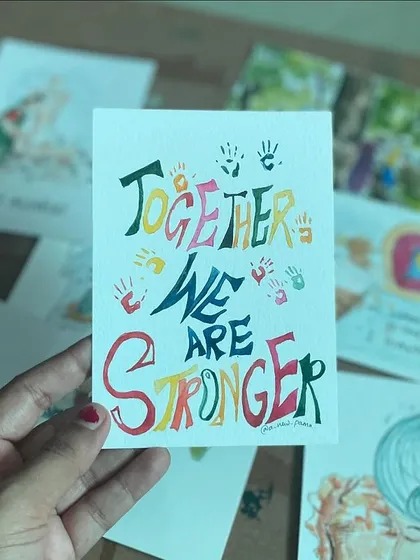 "Together We Are Stronger." A typography-based illustration with handprints, symbolizing unity and collective strength.