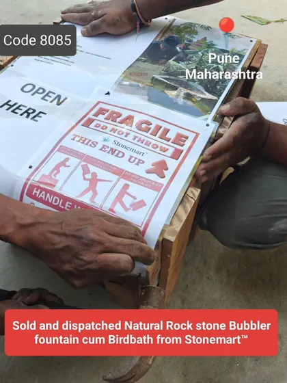 The sold and dispatched natural rock stone bubbler fountain, with clear fragile handling instructions.