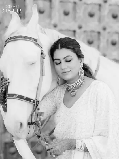 A quiet moment of connection between the bride and her majestic ride before she makes her grand entrance. These are the beautiful, unscripted shots I help create.