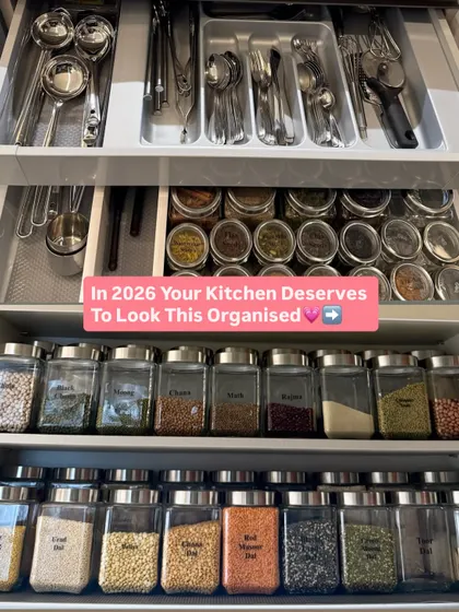 A complete kitchen system in one view. It shows organized drawers for cutlery and spices, as well as cabinets for decanted grains.