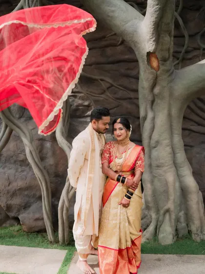 A beautiful portrait of the couple. The bride's makeup is designed to look fresh and radiant, ensuring she looks perfect next to her partner.