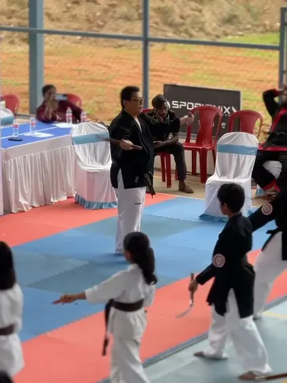 An instructor demonstrates a technique to students at the International Kobudo seminar held in our arena.