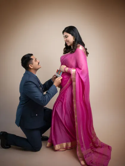 A moment of honor and love. A father-to-be from the Indian Air Force kneels before his wife, creating a powerful story of strength, respect, and endless love.