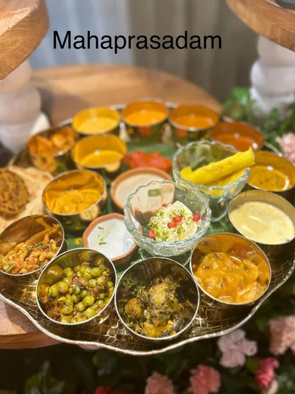 For a truly traditional and divine experience, I offer a Mahaprasadam thali. It features a beautiful assortment of vegetarian dishes, each prepared with care and devotion, offering a blessed and wholesome meal.