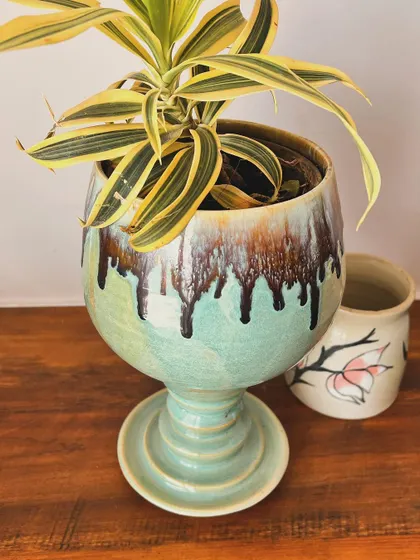 Another shot of the goblet planter. The way the brown and black glaze drips over the mint green is completely unique to this piece.