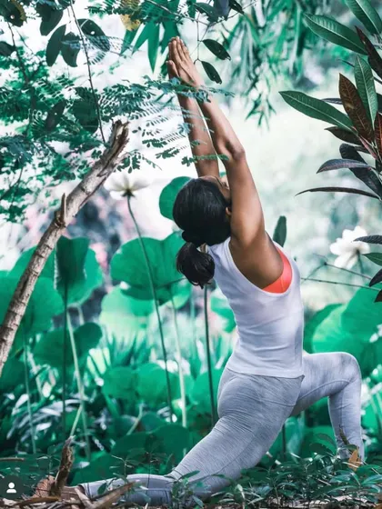 Finding strength and grace in the heart of nature. This Anjaneyasana or low lunge pose, surrounded by lush greenery, embodies the grounding and expansive feeling we cultivate in our practice.