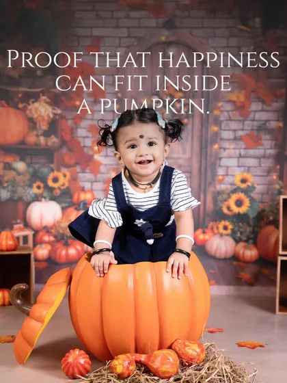 Proof that happiness can fit inside a pumpkin. This adorable autumn-themed shoot places a smiling baby inside a large pumpkin prop for a unique and heartwarming seasonal photo.
