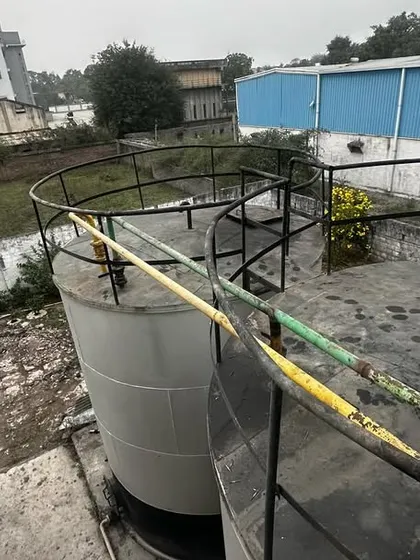 **Assessing Assets On-Site.** An overhead view of the storage tanks at a client facility. On-site visits are crucial for accurate financial assessment and advisory.