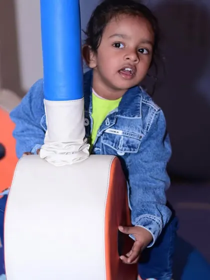 Exploring the soft play structure. The padded poles and soft surfaces are designed to keep kids safe as they climb and play.