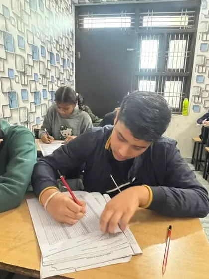 Students at our Dausa center working hard on practice sheets. We provide comprehensive study materials to all our franchises.