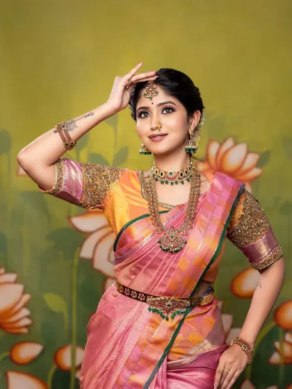This pose highlights the maang tikka and the intricate details of the bridal jewellery. The makeup is kept soft and glowing to complement the ornate accessories.
