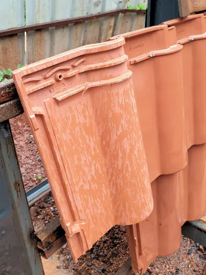 A close-up of the red mission tiles used for the Tellado Villas roof. These locally sourced tiles are not only sustainable but also deeply connected to the architectural heritage of Goa, reflecting the region's history and climate.
