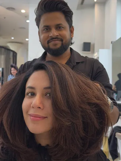 A happy client selfie showing off her fresh brown color. The volume and bounce we created with the styling really bring the look to life.