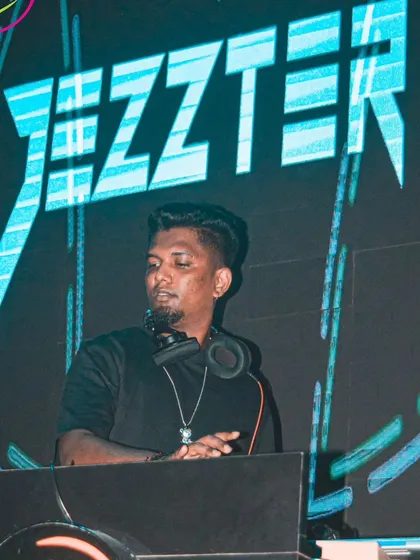 A clear shot of me at the DJ console with my logo on the screen. This highlights my professional branding during a live performance.