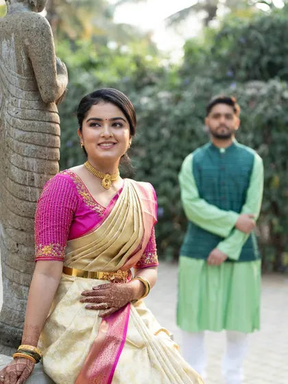 The couple posing for a pre-wedding photo. The bride's look is elegant and timeless.