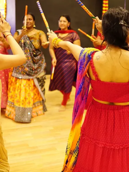 A view from within the circle during a Dandiya Raas practice. We teach traditional circular formations that look great on the Sangeet stage.