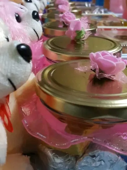 This affordable baby birthday return favor includes a mix of treats and a cute teddy bear. The jars are filled with my assorted handmade chocolates.