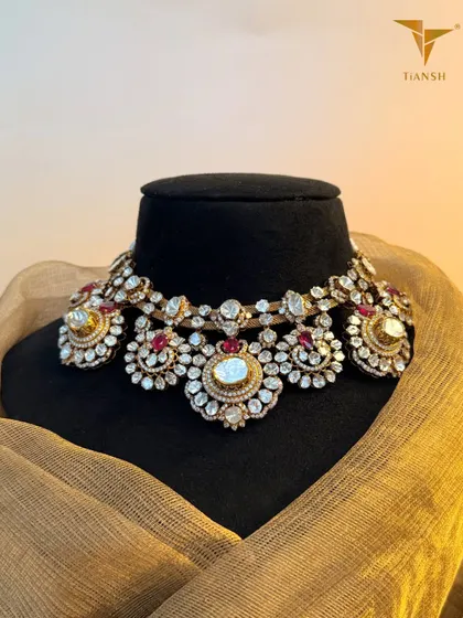 If you love old world charm with a new age presence, this Polki choker necklace is a dream crafted in deep hued rubies and intricate meenakari work. It is designed for the woman who carries tradition with modern confidence.