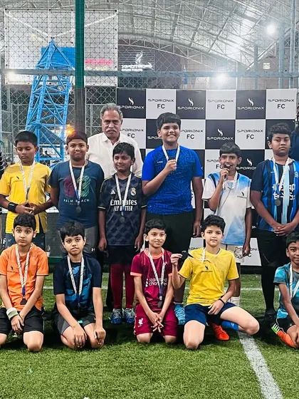 Another group of proud medal winners from the football tournament posing in front of our custom Sportonix FC backdrop.