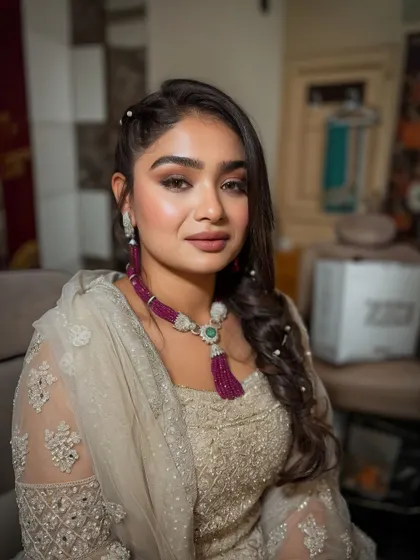 A close-up of the look, her eyes shining and her skin looking smooth.