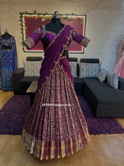 Front view of the deep purple langa voni, with a richly embroidered blouse and pleated Kanjivaram skirt.