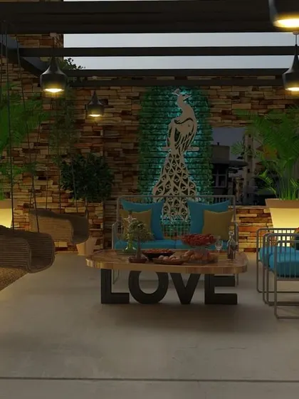 Another angle of the peacock-themed terrace, highlighting the cohesive design. The stone wall texture, warm lighting, and carefully selected plants work together to create a personalized and artistic outdoor living area.