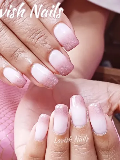 A soft ombré effect on natural nails with a gentle dusting of glitter on the tips for a subtle yet beautiful finish.