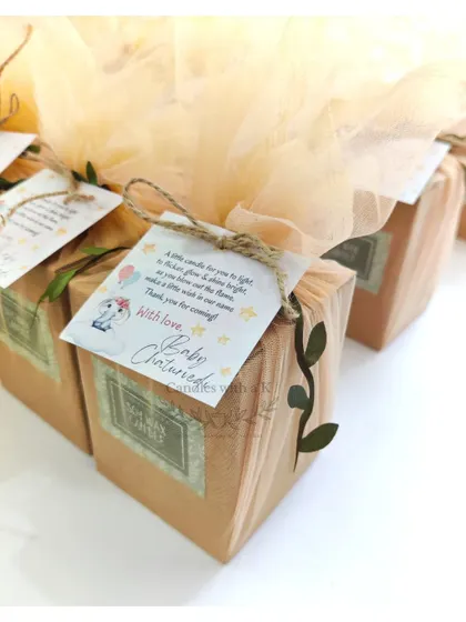 The elegantly packaged baby shower gift boxes, ready to be given to guests.