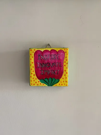 "Inspire, Innovate, Impact." A vibrant, floral-themed mini canvas with a powerful message, designed to add a pop of color and motivation to any space.