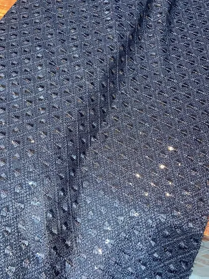 A deep navy blue Chikankari fabric with tonal embroidery and sequins. This is an excellent choice for creating a rich, formal kurta for evening wear.