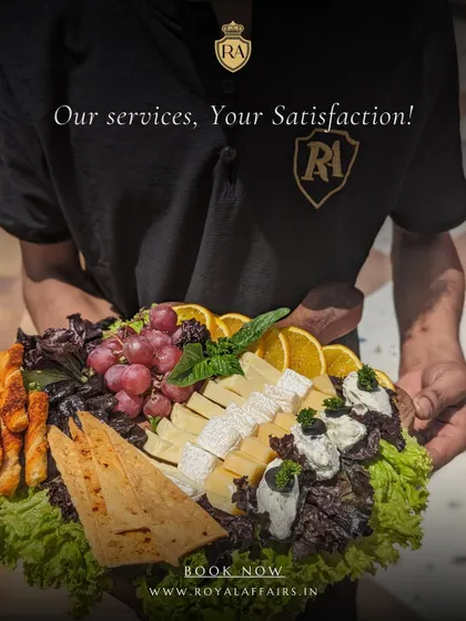 A staff member presents a freshly prepared cheese and fruit platter. This showcases my commitment to service, bringing beautiful and delicious food directly to your guests.