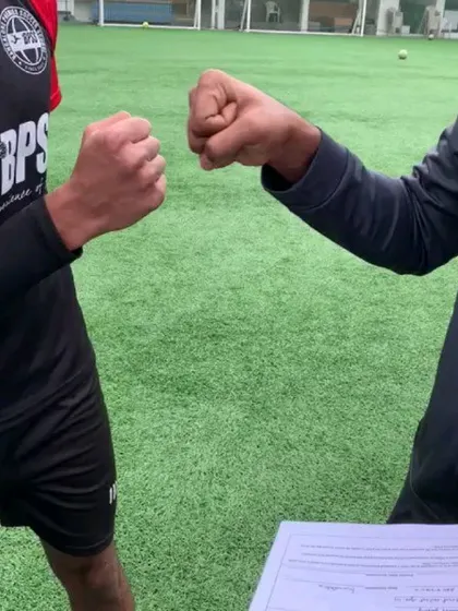 A fist bump sealing the deal. This signifies the trust and partnership between me and my players as they advance in their careers.