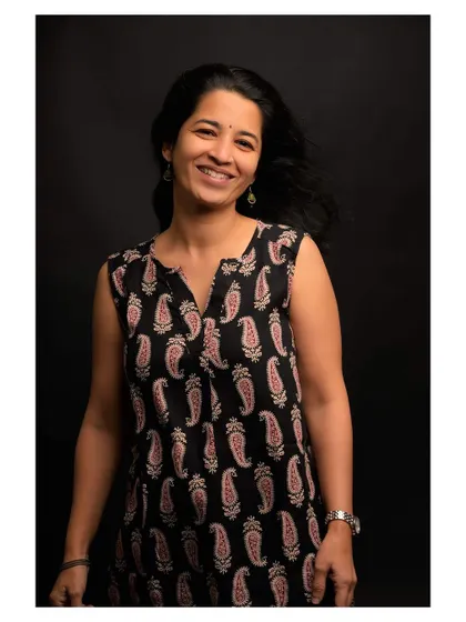 A similar portrait from the series, demonstrating consistency in capturing a warm and friendly demeanor.