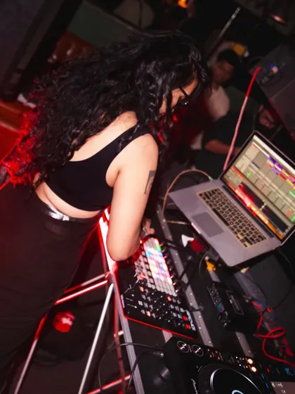 Here you can see my hybrid setup in action at a club. I'm using my laptop with Ableton Live and an APC40 controller alongside the club's Pioneer gear. We cover how to set up and perform these kinds of advanced sets.
