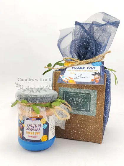 The complete packaged gift for the space-themed birthday, showing the custom box and tag.