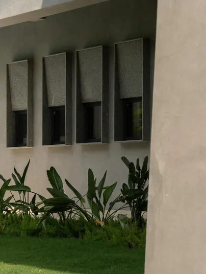 Various exterior perspectives that capture the dynamic geometry and the dance of light and shadow across the concrete surfaces throughout the day.