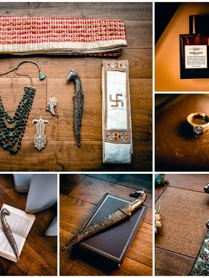 A flat lay of the groom's traditional accessories, including his ceremonial dagger (kirpan), emerald necklace, and wedding ring, showcasing the rich heritage.