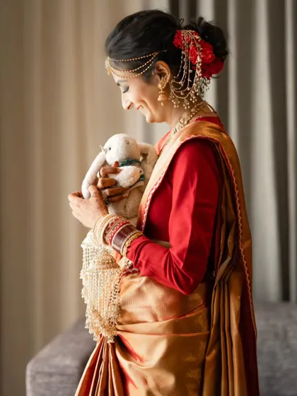 A sweet and personal moment as the bride holds a cherished stuffed animal before her ceremony. We capture the little things that hold big meaning.