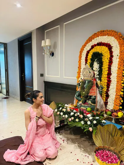 Another shot from the Ganpati puja, capturing a moment of gratitude.