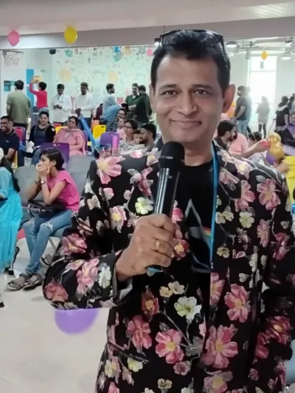 In a colorful floral jacket, ready to host a fun, casual event. I dress to match the vibe of the party, whether it's formal or a relaxed get-together.