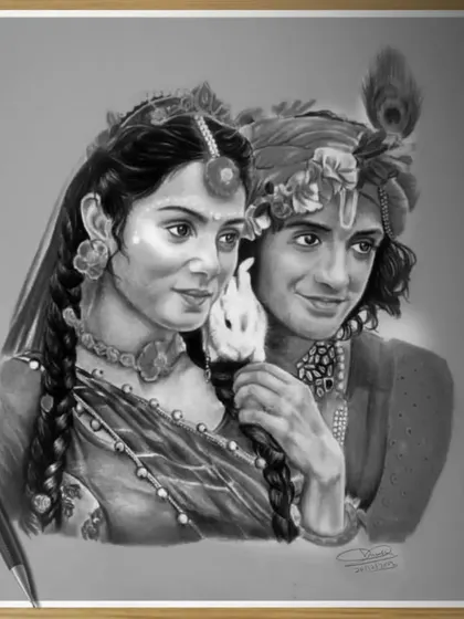 A dual portrait of Radha and Krishna, capturing a moment of divine love. This graphite piece focuses on their expressions and the intricate details of their traditional attire and ornaments.